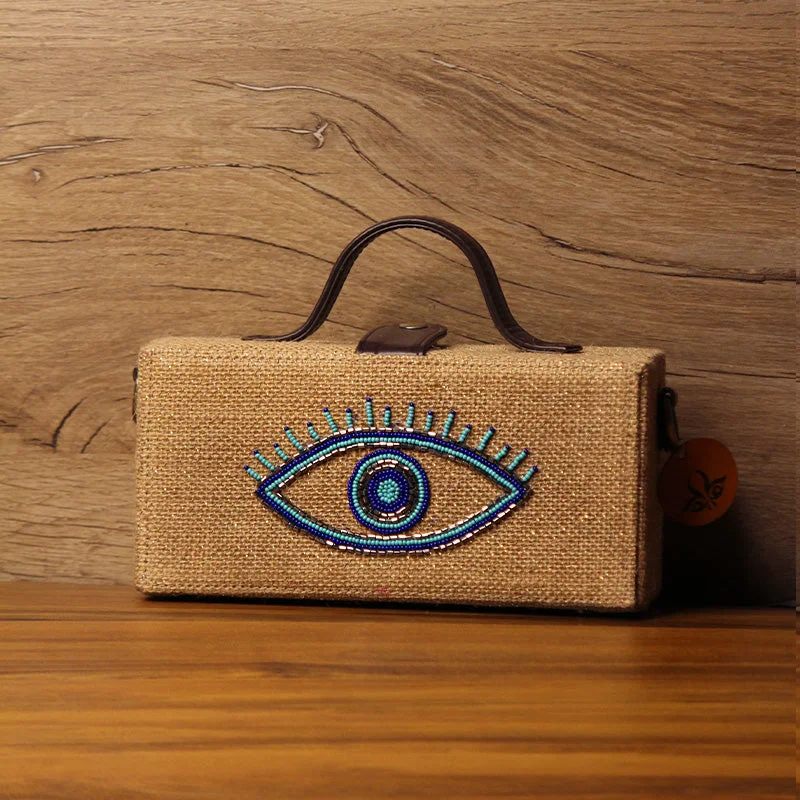 Evil eye hand embroidered jute clutch bag